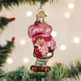 Strawberry Shortcake Christmas ornament shaped like a pink ice cream cone with a character inside, hanging on a tree.