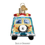 Decorative ornament of a vintage car with a surfboard on top against a white background