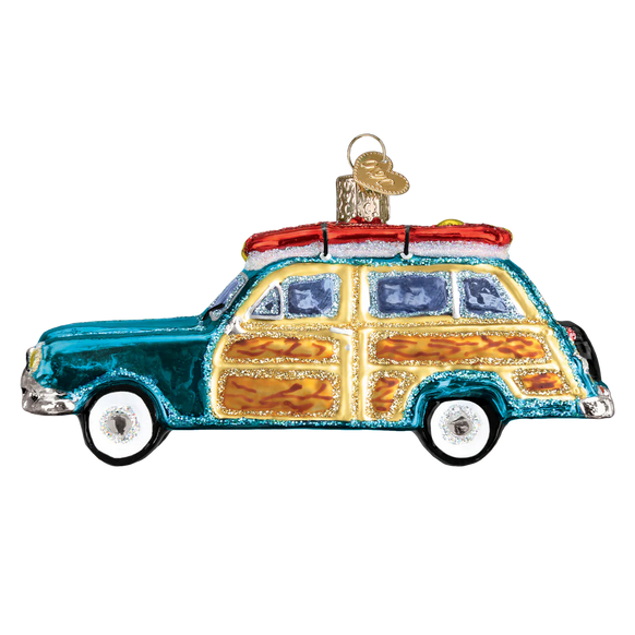 Decorative glass ornament of a vintage car with a wooden panel design on a white background