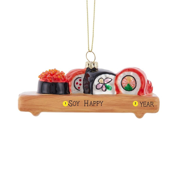 Personalized glass sushi board Christmas ornament with an example of “Soy Happy” and “Year” shown on the wood-look serving board.