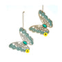 Two teal jeweled butterfly ornaments with glittered wing edges, faceted gem-style details, and green jewel bodies in aqua and gold-toned designs.