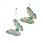Two teal jeweled butterfly ornaments with glittered wing edges, faceted gem-style details, and green jewel bodies in aqua and gold-toned designs.