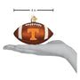 Decorative football ornament with 'T' logo on a white background, shown with a hand for scale.
