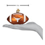 Glass football ornament with Texas Longhorns logo held in a hand, with a measurement label indicating 4 inches.