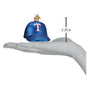 Blue baseball cap ornament with Texas Rangers logo on a hand holding it, showing its size.