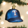 Blue baseball cap ornament with Texas Rangers logo on a Christmas tree.