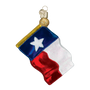 Glass ornament shaped like a Texas flag on a white background