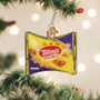 Totino's Pizza Rolls ornament hanging on a Christmas tree with blurred lights in the background