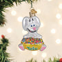 Decorative Christmas ornament of a Trip Rabbit with a colorful bowl on a blurred Christmas tree background.