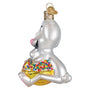 Glass ornament of a Trix rabbit on a box of Trix cereal with a white background side view
