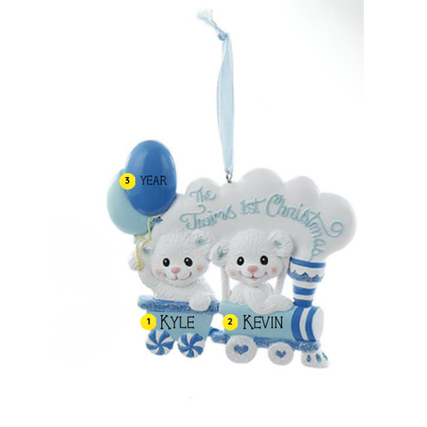 Personalized Twins’ 1st Christmas ornament with two white bears in a blue train, blue balloons, and space for two names and a year.