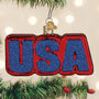 Decorative ornament with 'USA' in red and blue on a Christmas tree.