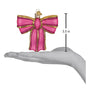 Pink bow ornament with gold accents on a hand for scale, showing size of 3.5 inches.