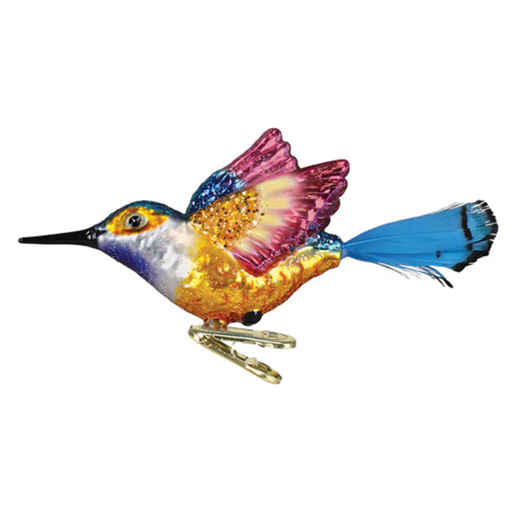 Colorful glass hummingbird ornament on a white background