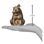 Vintage Glass bear ornament on a hand with a measurement label indicating 3.75 inches.