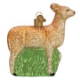 Glass ornament of a vintage deer with a green base on a white background