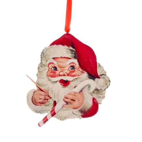 Vintage-style Santa face ornament with rosy cheeks, red hat, white beard, paintbrush, and a red and white striped candy cane.