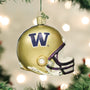 Gold Washington football helmet ornament with 'W' logo on a Christmas tree.