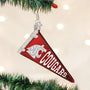 Decorative ornament shaped like a red pennant with 'WSU Cougars' text and logo, hanging on a Christmas tree.