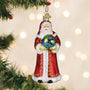 Decorative Christmas ornament of a Santa Claus figure holding a globe, hanging on a tree with lights in the background.