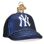 Glass ornament shaped like a blue baseball cap with a white New York Yankees logo on a white background