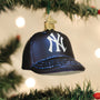 Blue baseball cap ornament with a New York Yankees logo on a Christmas tree