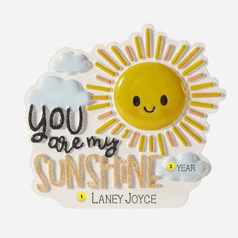 Decorative Ornament with a sun design and 'You are my sunshine' text on a white back round