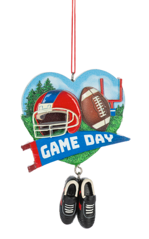 Heart-shaped football ornament with a helmet, football, goalpost, blue “Game Day” banner, and dangling black cleats.
