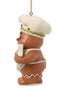 Side view of Jim Shore Gingerbread with Cookies Ornament showing the gingerbread character’s chef hat, apron bow, and cookie details.