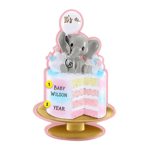 Pink Gender Reveal Ornament Cake with Pink inside and baby elephant on top holding a ballon that says "it's a"