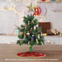 Old World Christmas Gumdrops 18" mini unlit Christmas tree decorated with mini ornaments, mini tree topper, and mini tree skirt sold separately.