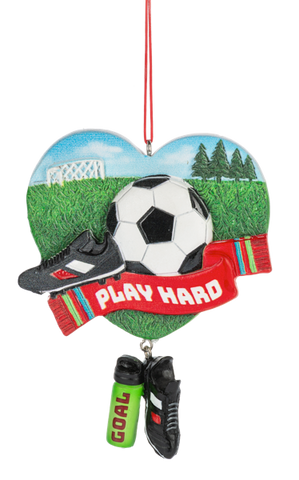 Heart-shaped soccer ornament with a soccer ball, black cleat, red “Play Hard” scarf, water bottle, and dangling black cleats.