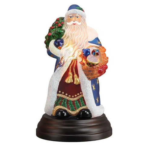 Front view of Old World Christmas Regal Father Christmas Light holding a Christmas tree and basket of toys