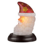 Side view of Old World Christmas Santa Moon Face Light with glowing face, white beard, and red star-covered hat