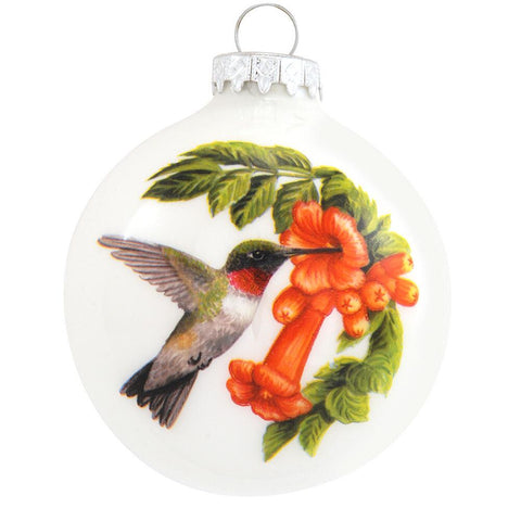 Hummingbird with flowers on front and the symbolism on the backside. Glass Ornament