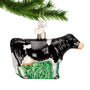 Dairy Cow Black & White Ornament hanging by a gold swirl hook