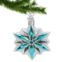 Blue, White and Silver Glass Snowflake Ornament hanging by a silver hook