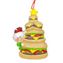 Stack or Hamburgers and cheeseburgers with a smiling person peeking out from behind christmas ornament 