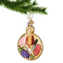 Charcuterie Board Glass Ornament hanging from a gold swirl hook