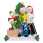 Family of 4 decorating a Christmas tree ornament 