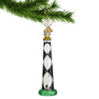 Glass Lighthouse Ornament Cape Lookout hanging by a gold swirl hook from a Christmas tree branch