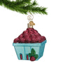 Glass Raspberry Carton Ornament hanging by a gold swirl hook from a Christmas tree branch