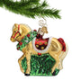 Glass Horse Ornament Tan Horse wearing a Christmas wreath, with red saddle and red ribbon on tail hanging from a gold swirl hook on a Christmas tree branch