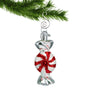 Glass peppermint candy ornament hanging by a sliver hook