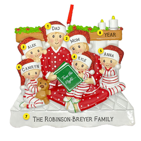 Personalized Family Ornament for Family of Six with four kids reading in bed in pajamas names and dated for the year