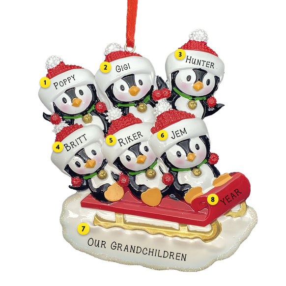 Personalized Family of 6 ornament with six penguins sledding