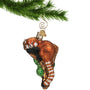 Red Panda Ornament Blown Glass hanging by a gold swirl hook from a Christmas tree branch
