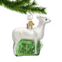 Glass White Deer Ornament hanging from a gold swirl hook on Christmas tree branch