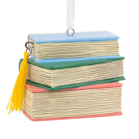 Stack of Books in pastel colored binding with a gold bookmark tassel 