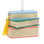 Stack of Books in pastel colored binding with a gold bookmark tassel 